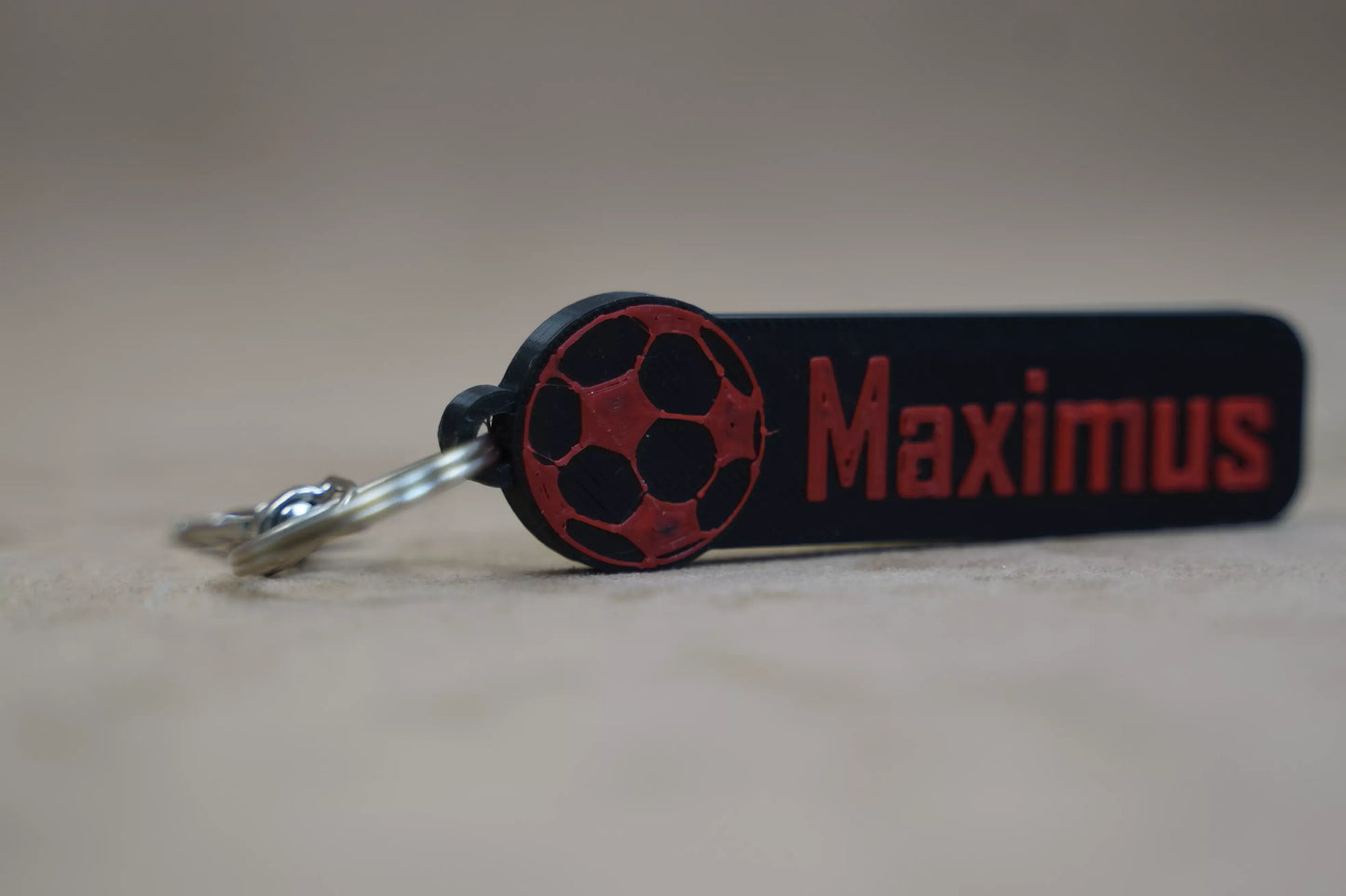 Personalised football keychain with the name Maximus and a soccer ball design, ideal for football fans.