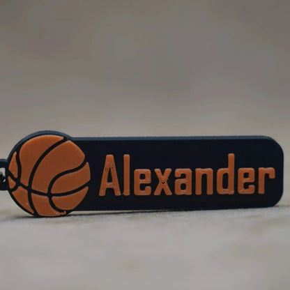 Personalised basketball keychain featuring the name "Alexander" and a basketball graphic design.