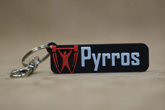 Personalised weightlifting keychain with the name Pyrros, showcasing a fitness design for gym enthusiasts.