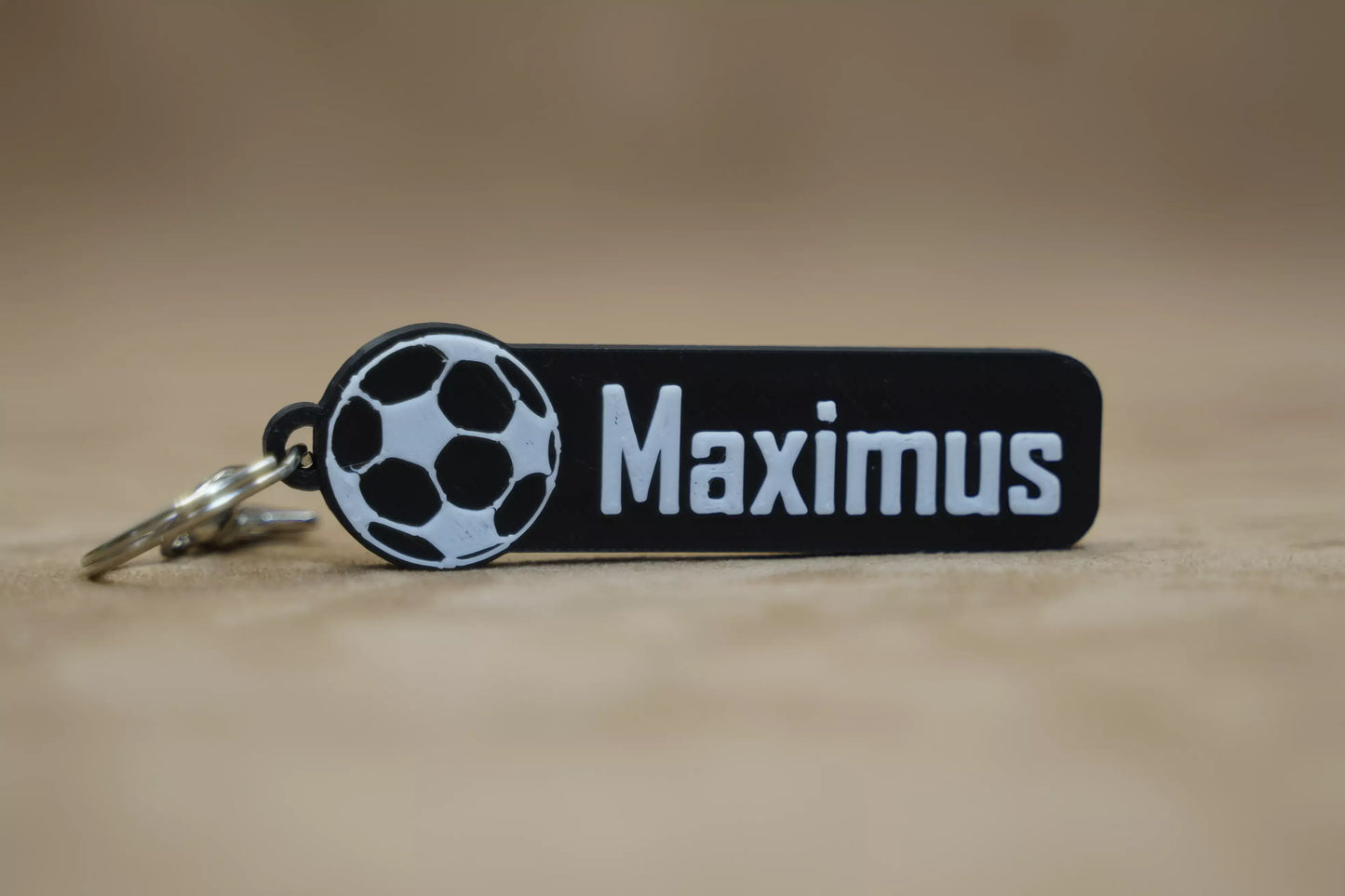 Personalised football keychain with the name Maximus and a soccer ball design, ideal for football fans.