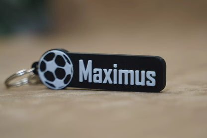 Personalised football keychain featuring the name 'Maximus' and a soccer ball design, perfect for football fans.