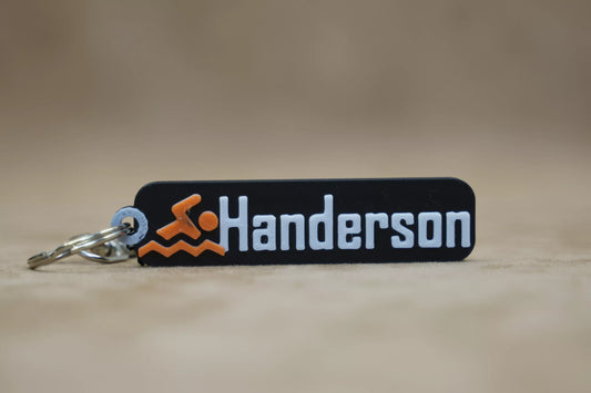 Personalised swimmer keychain with the name 'Handerson' and swim-themed design, perfect for swim lovers.