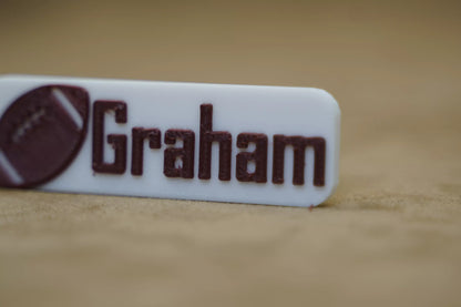 Personalised footy keychain with the name "Graham" and a football graphic, perfect for footy fans.