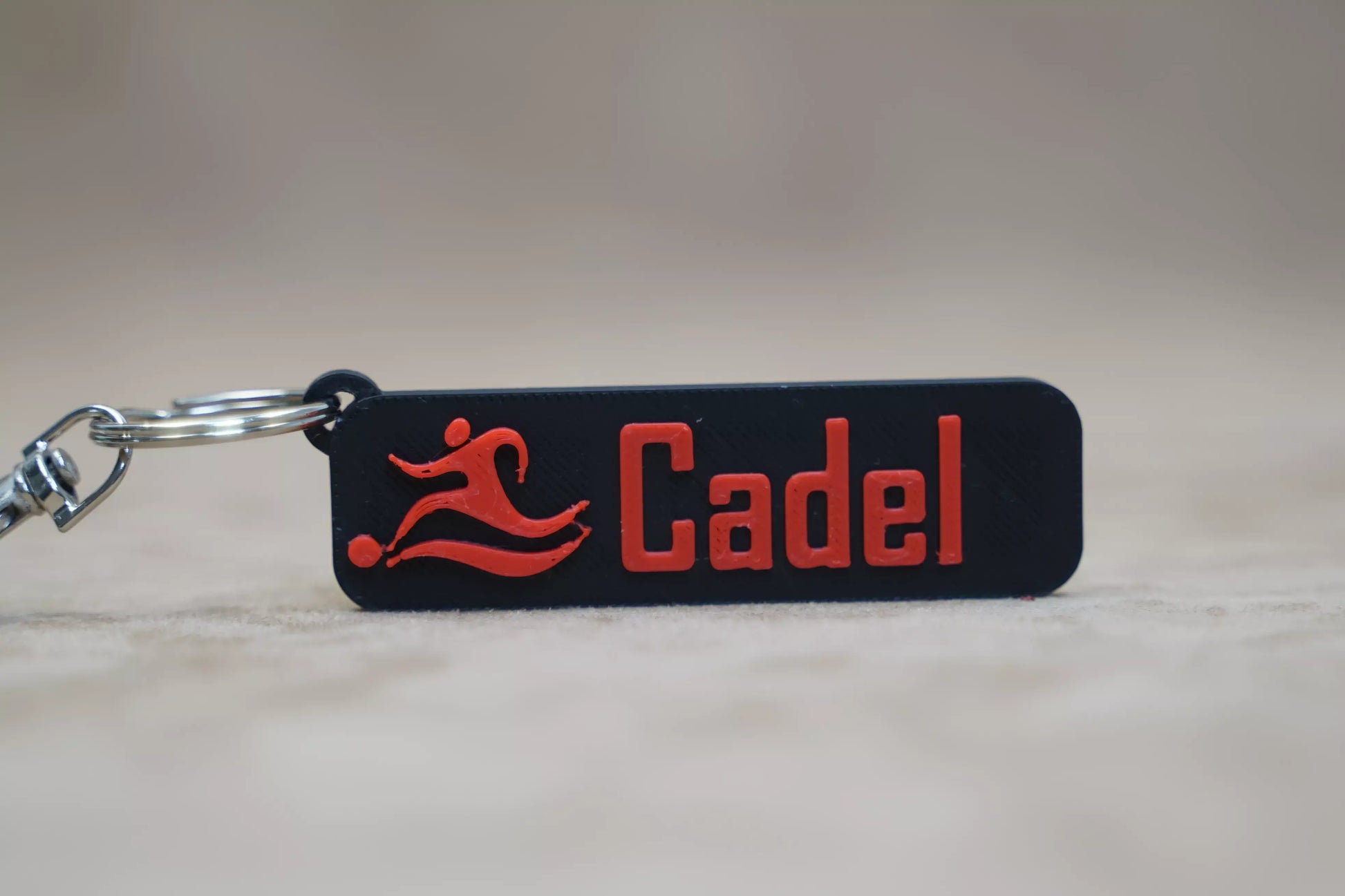 Personalised keychain featuring the name 'Cadel' with a football logo, perfect for football fans.